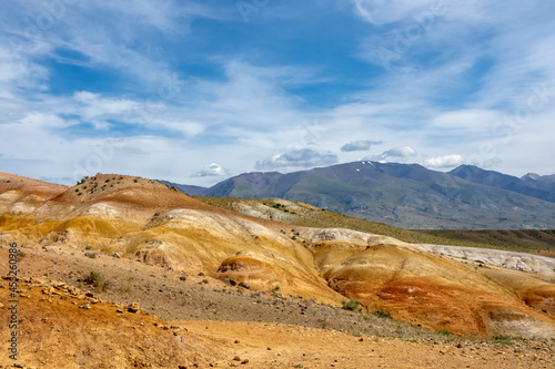 mountain peaks in mountain altai and blue sky with clouds