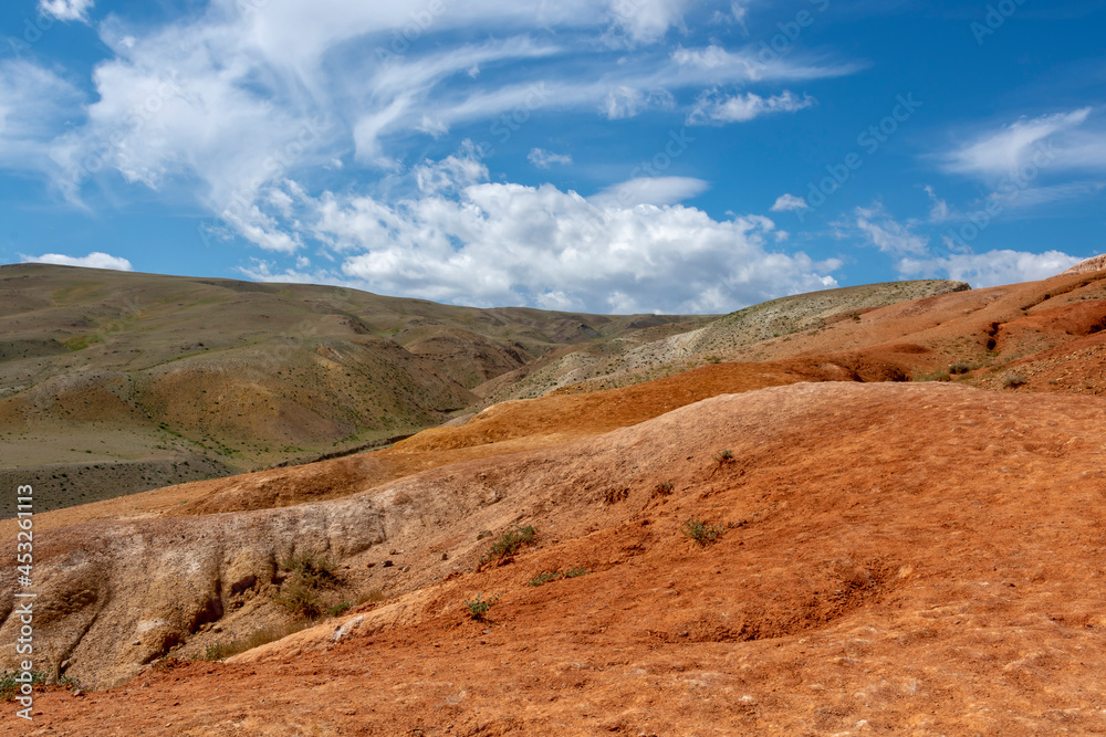 the slope of a small mountain of red sandstone the slope of a small mountain of red sandstone