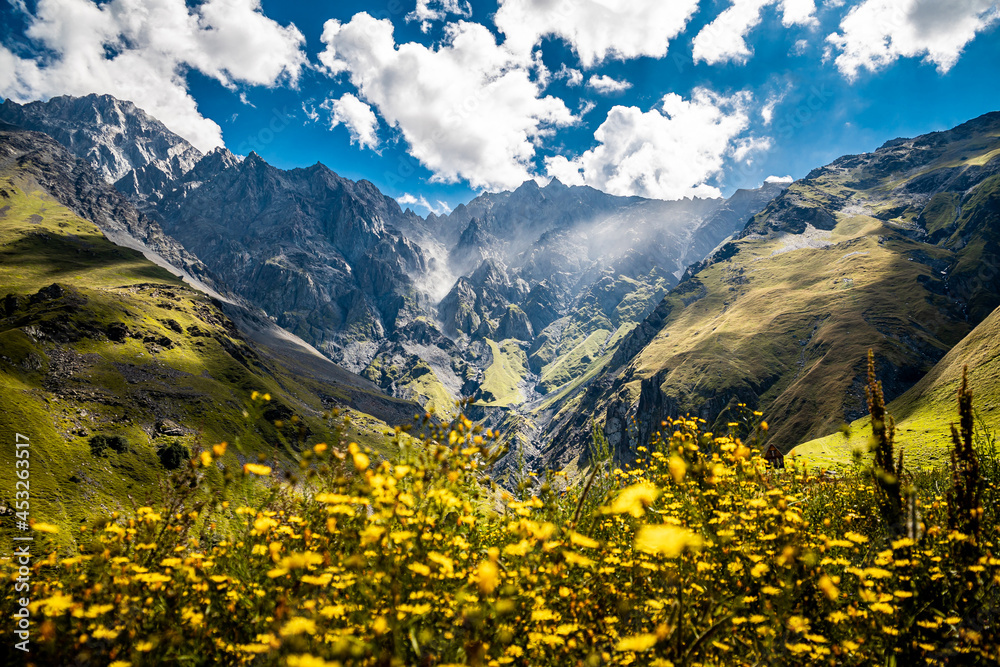 Panorama Of Beautiful Georgian Mountains Landscape. Mount Shani, is the highest mountain of Ingushetia near Stepantsminda Kazbegi on the border with Georgia in Greater Caucasus Range.