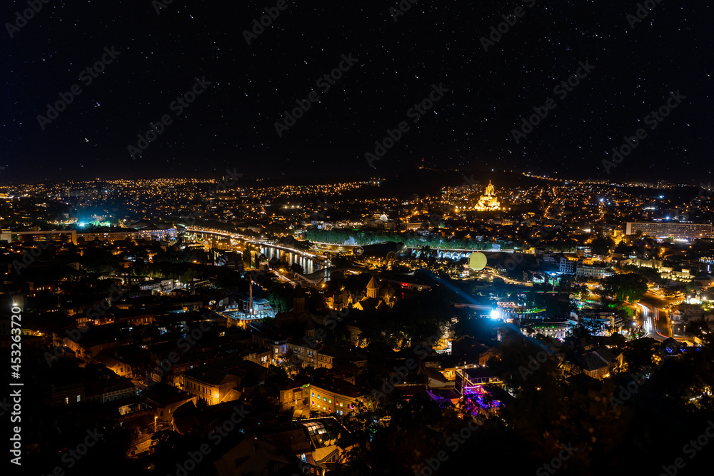 Tbilisi city panorama at night. Old city, new Summer Rike park, river Kura, the European Square and the Bridge of Peace