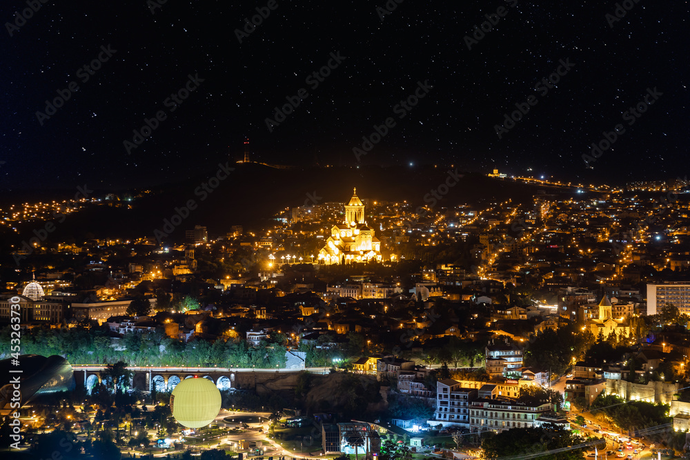 Naklejka premium Tbilisi city panorama at night. Old city, new Summer Rike park, river Kura, the European Square and the Bridge of Peace