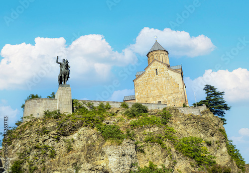 Metekhi St. Virgin Church and King Gorgasali Statue over Kura river, Tbilisi, Georgia photo