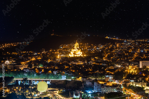 Tbilisi city panorama at night. Old city  new Summer Rike park  river Kura  the European Square and the Bridge of Peace