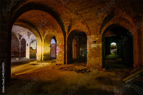 Vaulted red brick dungeon under old mansion © Mulderphoto