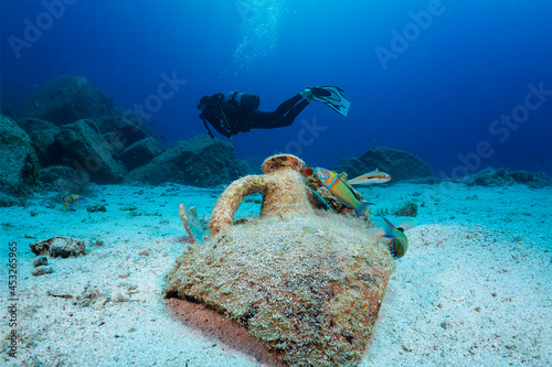 Canvastavla Scuba diving in Greece: an ancient, Greek Amphora with a diver silhouette behind