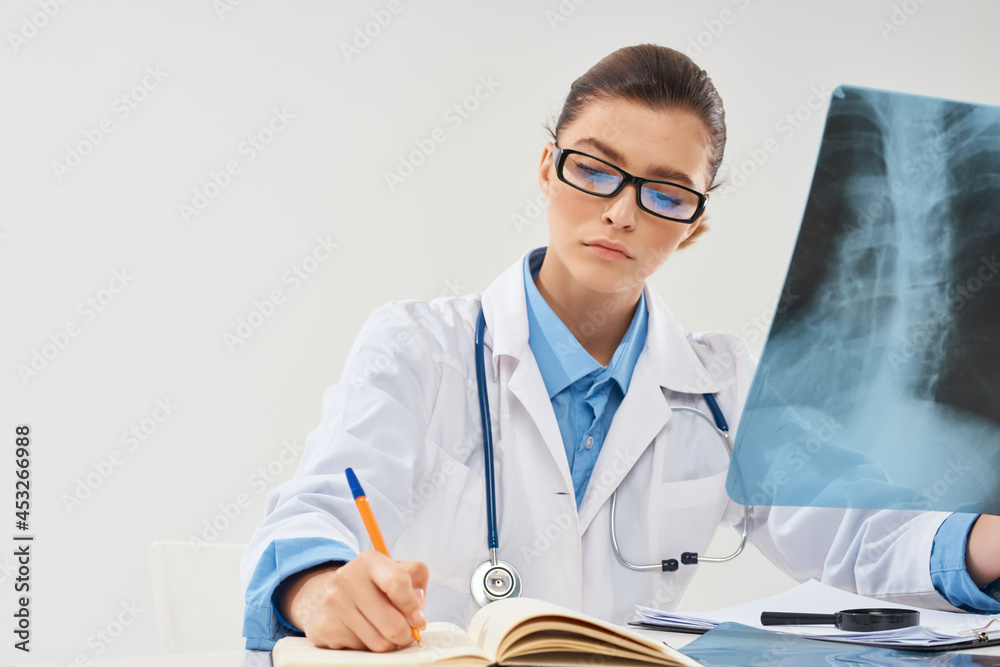 radiologist sitting at the table x-ray diagnostics treatment radiologist sitting at the table x-ray diagnostics treatment