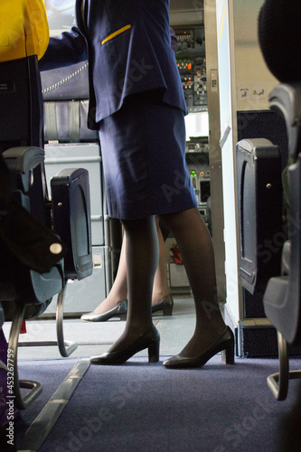 2020.12.27 Milan Malpensa Airport, Ryanair low cost airline in flight to Italy,
flight attendant waiting for passengers before take off photo