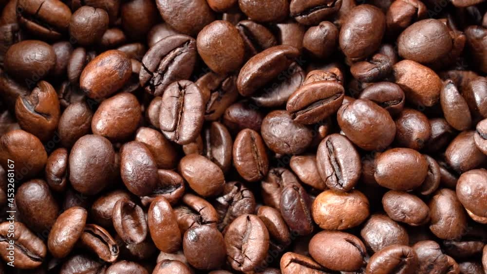 The background of roasted coffee beans rotates. High quality FullHD footage The background of roasted coffee beans rotates. High quality FullHD footage