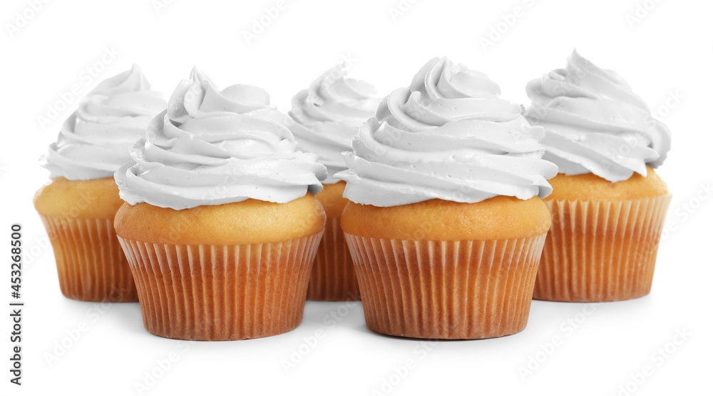 Delicious cupcakes decorated with cream on white background