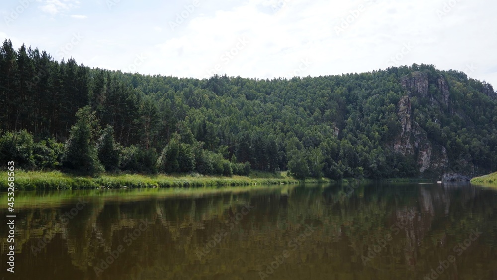 South Ural mountains with a river. The nature of the South Urals in Russia. South Ural mountains with a river. The nature of the South Urals in Russia.