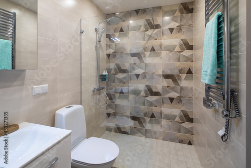 Modern interior of bathroom in apartment. Toilet and shower.