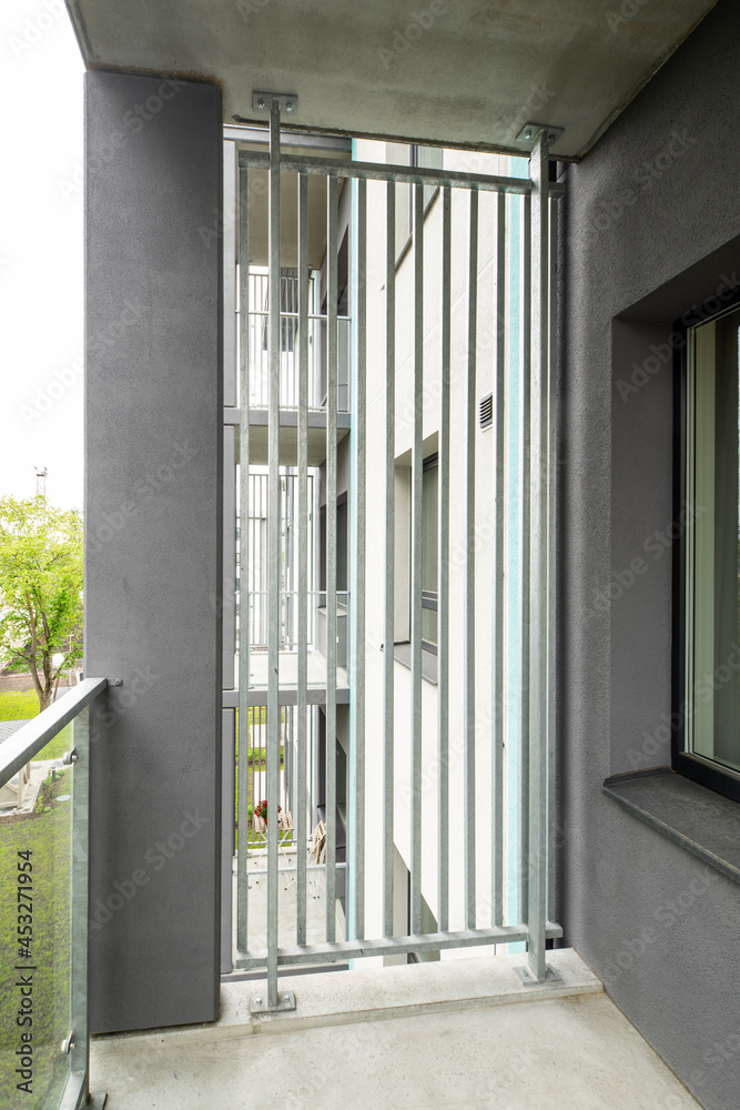 Balcony in luxury residential complex. Modern design. Metal partition. Stock Photo Adobe Stock
