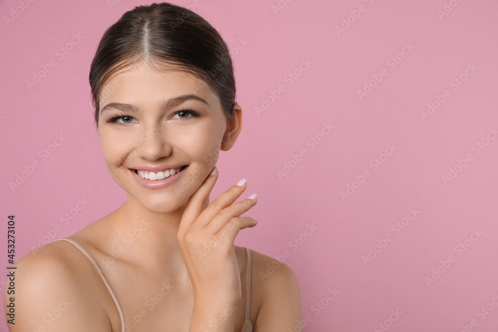 Portrait of pretty girl on pink background, space for text. Beautiful face with perfect smooth skin Portrait of pretty girl on pink background, space for text. Beautiful face with perfect smooth skin