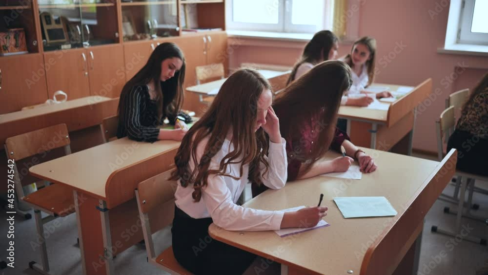 Pupils of the 11th grade in the class at the desks during the lesson. Russian school. Pupils of the 11th grade in the class at the desks during the lesson. Russian school.