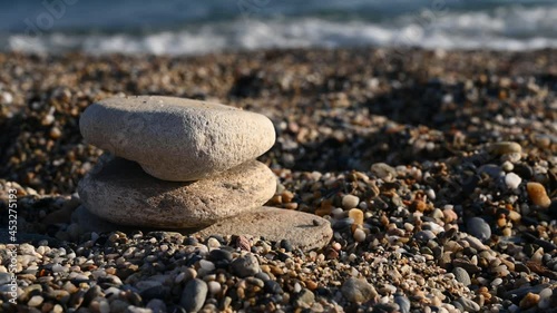 Lined stones on the background of the sea 