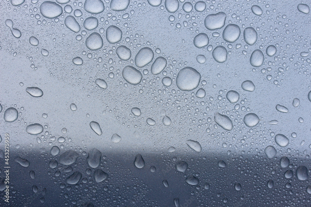 Rain drops on a silver vehicle Rain drops on a silver vehicle