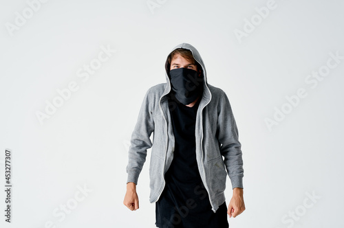 a man in a hood in a mask burglary theft anonymity crime