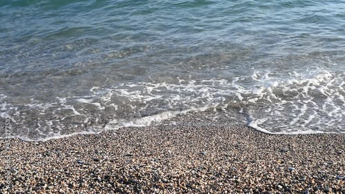 Sea water on the beach, top view