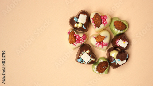 Handmade heart-shaped sweets. Sweets on a light yellow background. Valentine's Day Candy