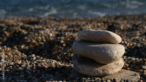 Lined stones on the background of the sea 