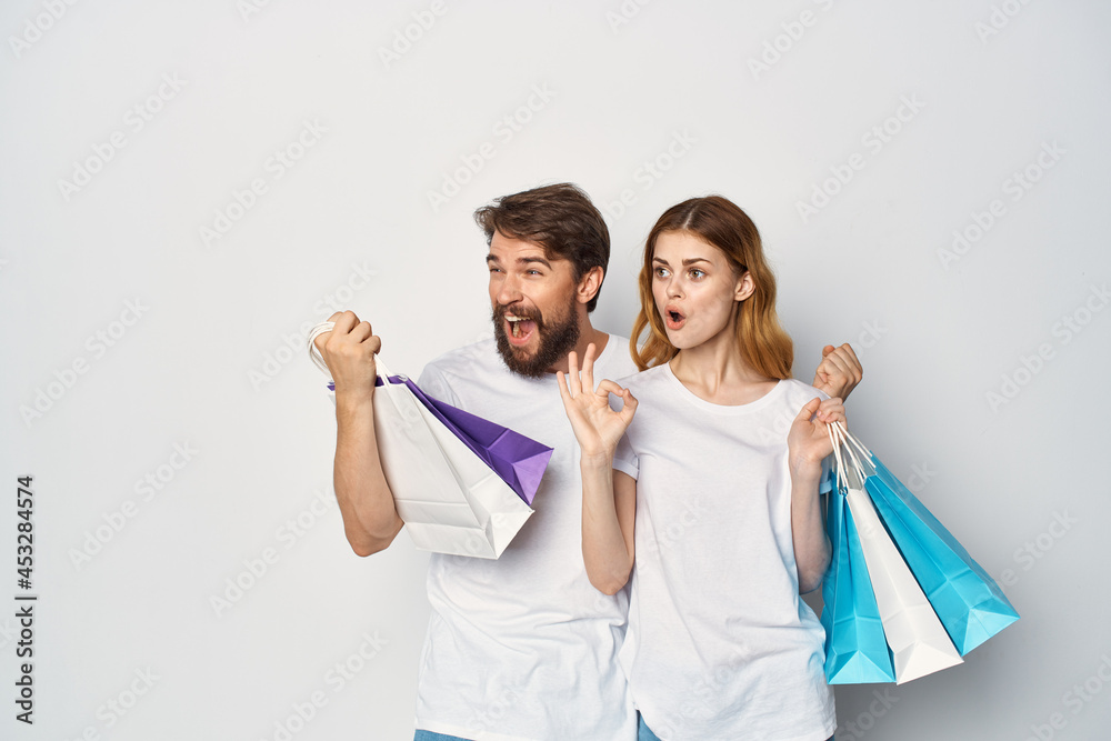 man and woman with packages in their hands discounts Shopping man and woman with packages in their hands discounts Shopping