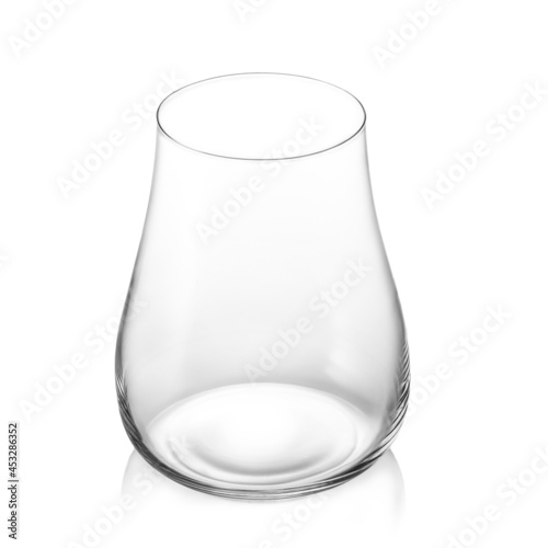 Empty transparent glass cup in the shape of a tulip on a white background. Isolated.