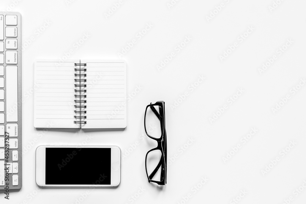 Workspace with keyboard and mobile office desk white background top view mock up Workspace with keyboard and mobile office desk white background top view mock up