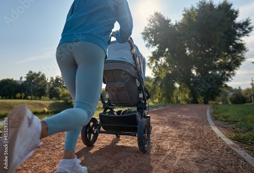 Фотография Active mother jogging