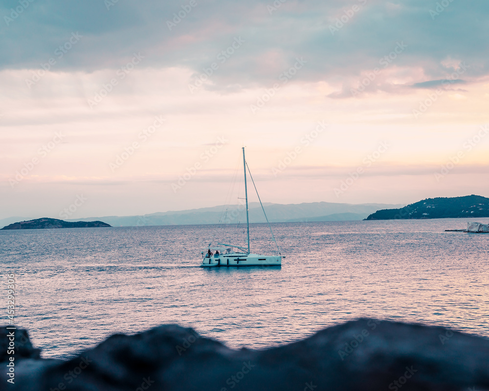 Sailing at dawn, Skiathos island, Greece