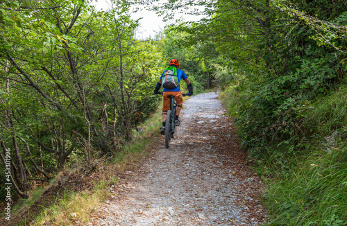 Biker on the hiking trail of the "Parco delle Mura" in Genoa, Italy.