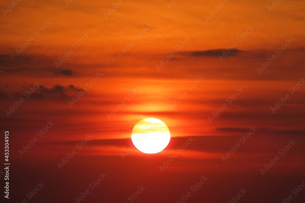 Beautiful fiery red sunset background in the sky