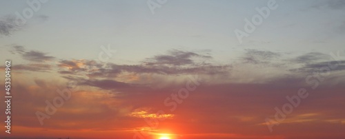 Panoramic view of beautiful orange sunset background