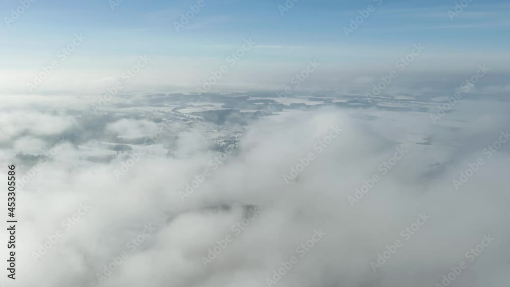 An amazing aerial shot of a winter landscape above the clouds. An amazing aerial shot of a winter landscape above the clouds.