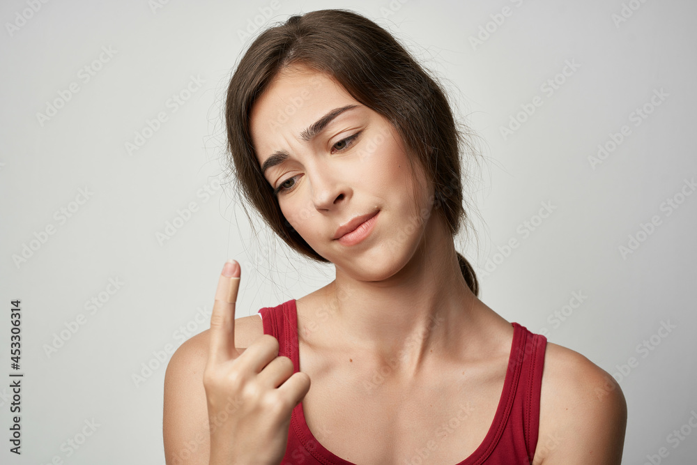woman showing index finger injury health problems close-up woman showing index finger injury health problems close-up