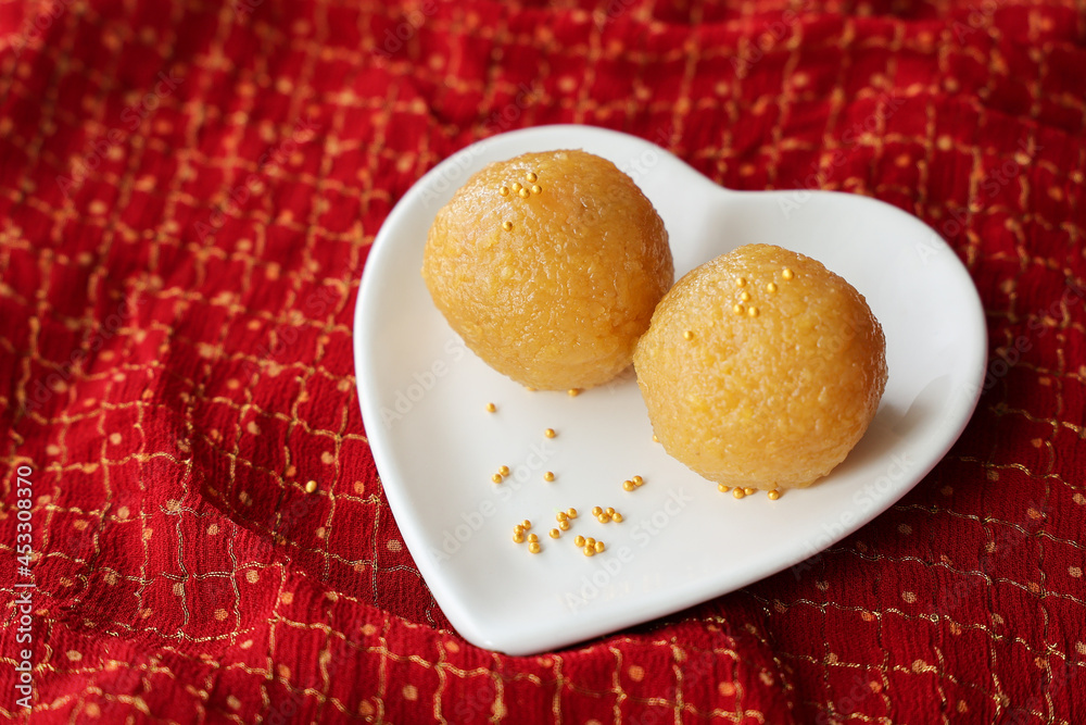 Motichoor Laddu Rava Laddu, Kesar laddoo Semolina Ladoo Indian sweet dish mithai Diwali Dussehra Holi Ram Navmi Ganesh chaturthi festival dessert snack golden plate Kerala Mumbai India Sri Lanka Motichoor Laddu Rava Laddu, Kesar laddoo Semolina Ladoo Indian sweet dish mithai Diwali Dussehra Holi Ram Navmi Ganesh chaturthi festival dessert snack golden plate Kerala Mumbai India Sri Lanka