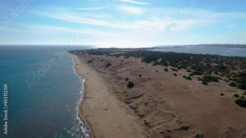 Chalikounas beach on a land strip between Lake Korission and Ionian Sea on Corfu Island in Greece, 4k video photo