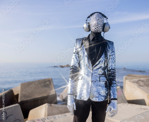Mr disco man with sparkly face and headphones
