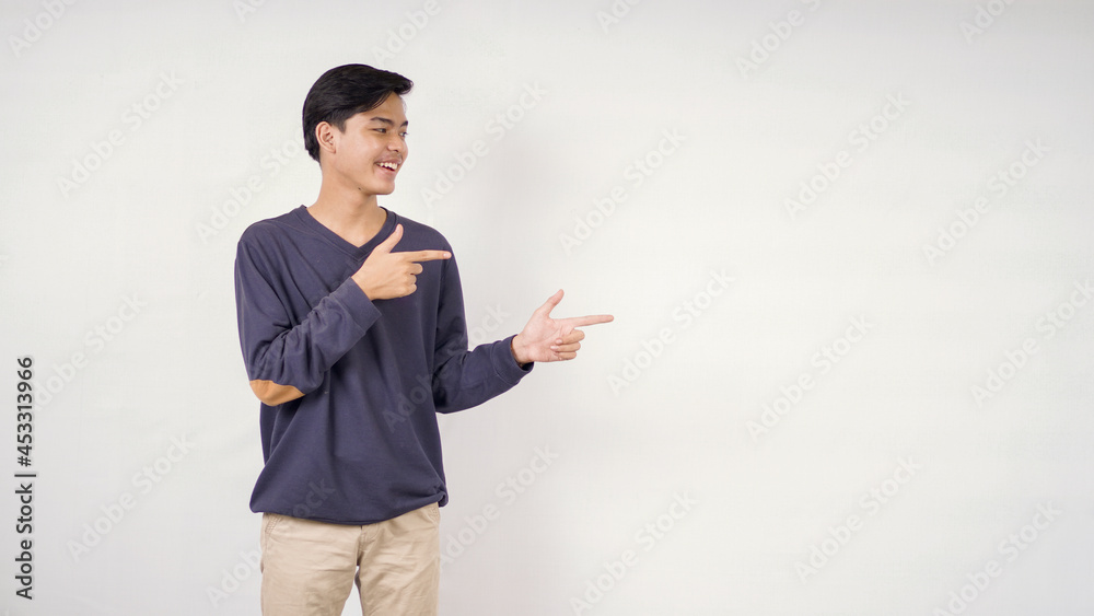 Asian man pointing blank space to side isolated on white background Asian man pointing blank space to side isolated on white background