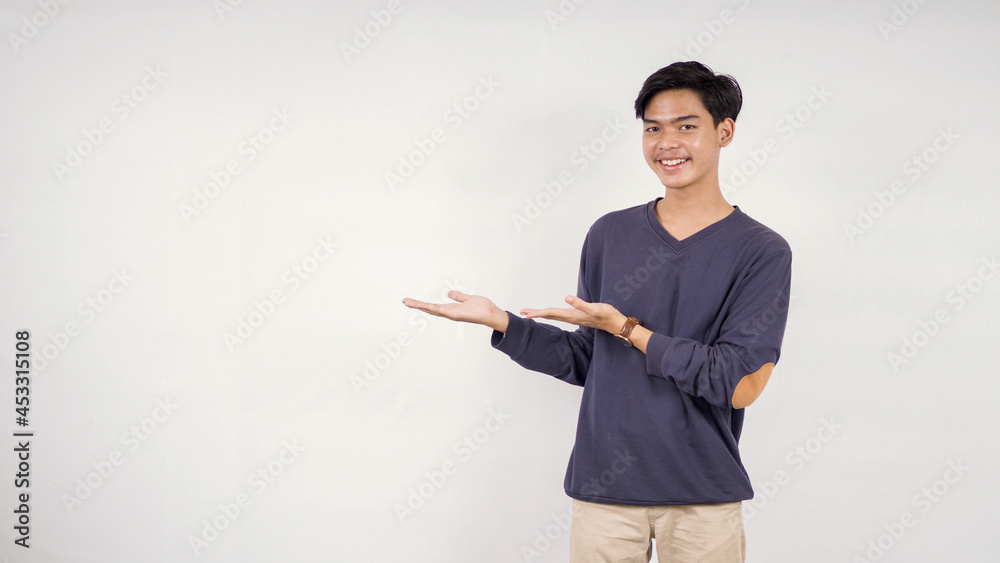 Asian man pointing blank space to side isolated on white background Asian man pointing blank space to side isolated on white background