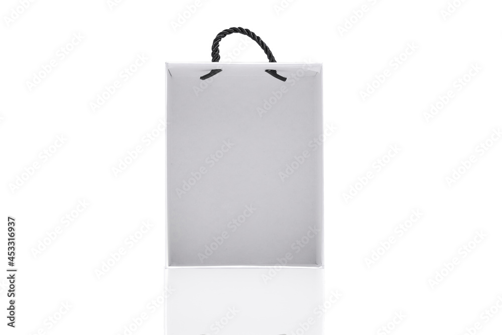 A small white bag for storing things with a rope tied on a white background.