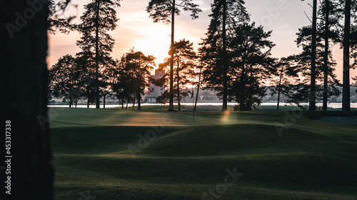 Golf green in sunset at the coast