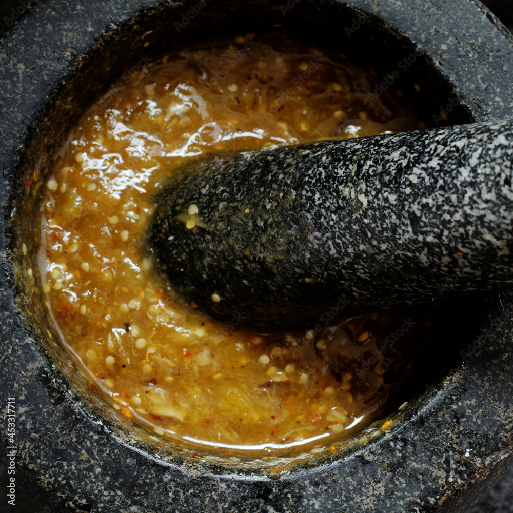 Roasted tomatillo salsa with toasted chilies de arbol powder in