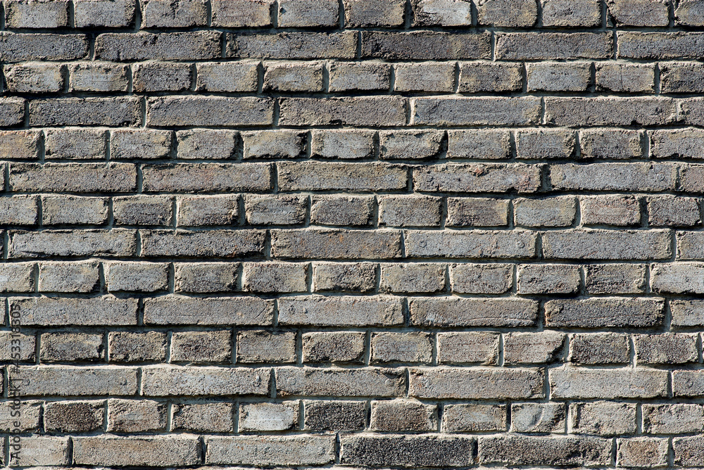 Close up of grey brickwall. Wall background. Old bricks. Close up of grey brickwall. Wall background. Old bricks.