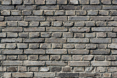 Close up of grey brickwall. Wall background. Old bricks.