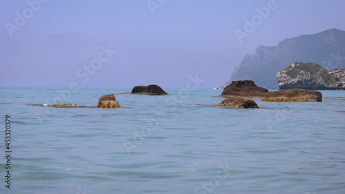 Ionian Sea shore in Agios Gordios town on a Greek Island of Corfu, 4k video photo