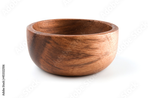 Empty wooden bowl isolated on white background