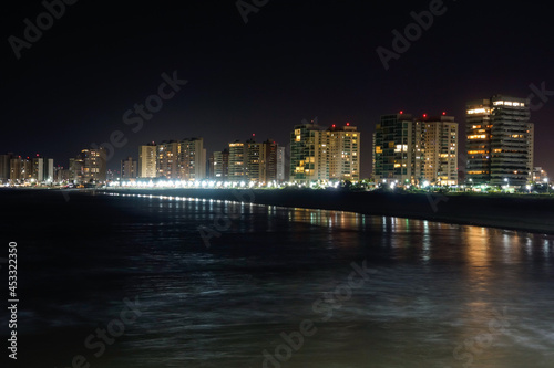 sea and cityscape of Sao Luis, Maranhao, Brazil. nightscape, light reflections