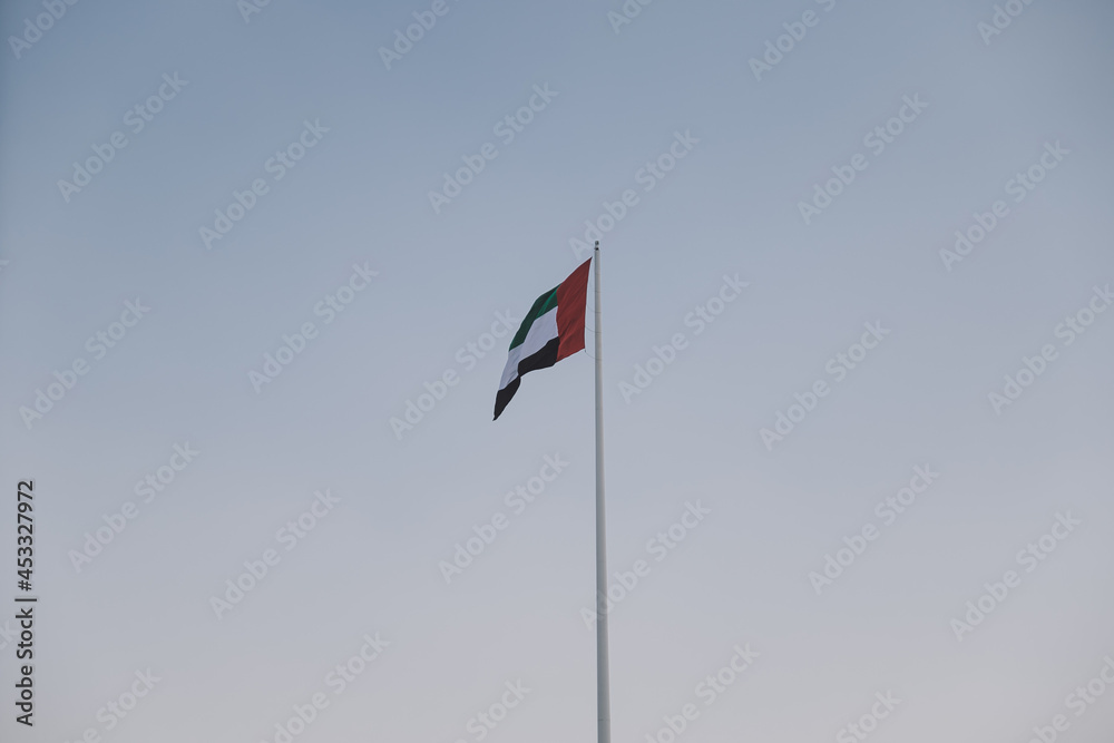 National UAE Waving Flag with Blue Sky View