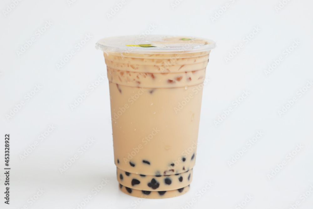 Small plastic cup Iced milk tea Taiwan style on white background, fresh cool sweet drink, Isolated fresh sweet drink, food and drink concept