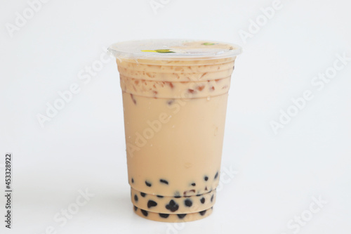 Small plastic cup Iced milk tea Taiwan style on white background, fresh cool sweet drink, Isolated fresh sweet drink, food and drink concept